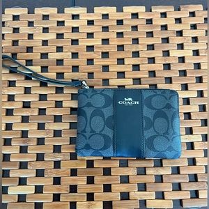 Coach wristlet, signature print in black. Never used.